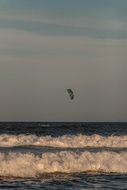 kitesurfer far from the beach