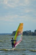 surfer with sail on the waves