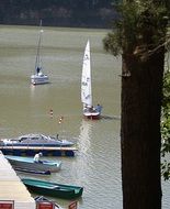 sailing boats at the wooden pier