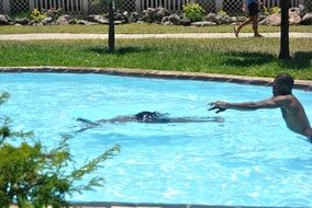 swimming in the pool on vacation