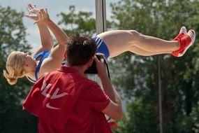 Photographer captures an athletics in a jump
