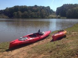 kayaks on the river bank