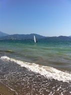 windsurfing in a beautiful landscape