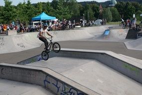 athlete does tricks on a bicycle