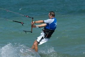 man holding the rope from the parachute