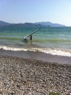 windsurfer on the waves near the beach