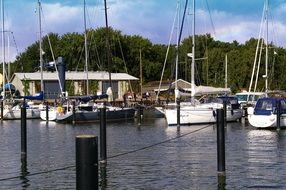 Sailing boats near the shore in the background of a picturesque landscape