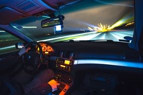 interior lights in the car and the lights of the night city