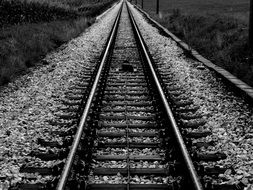 dark empty railroad tracks