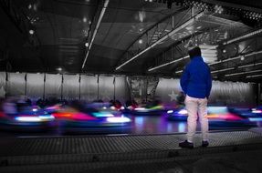 young man near the luminous bumpers