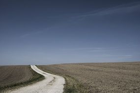 grunge path in rural landscape