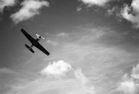 airplan in the sky in black and white background