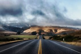 Highway in California against the backdrop of a scenic landscape