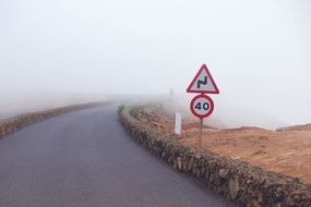 road signs on the edge of the road