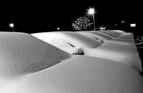 landscape of lots of snow on a parked autos