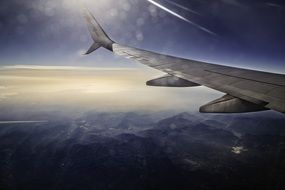 wing of the plane in the rays of the bright sun