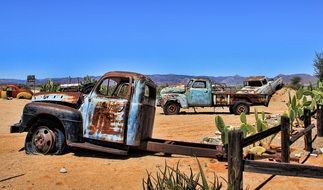 old rusty trucks in the desert on a sunny day