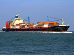 cargo ship with containers on the water