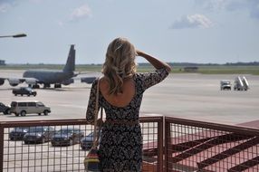 woman watching runway