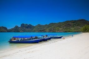 blue boats as a water mode of transport