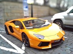 yellow lamborghini Brno racing car on the pavement