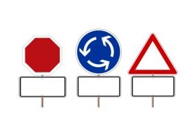 three road signs with blank shields