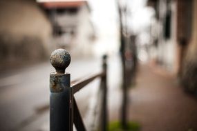 rusty metal fence on the street