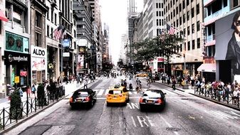 Yellow cab and black cars in New York