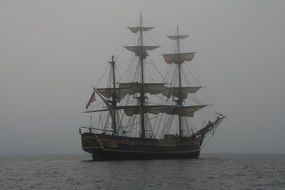 schooner in the ocean in the fog