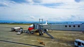 boarding passengers on a plane at the airport