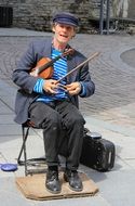 street musician with violin in Canada