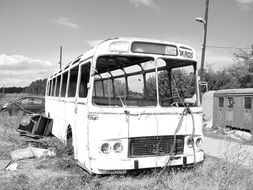 rusty abandoned bus in black and white background