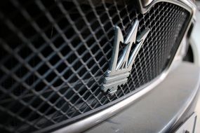 emblem of the Maserati car close up