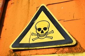 skull and bone on a triangular sign
