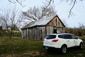 white car near the old barn in kentucky