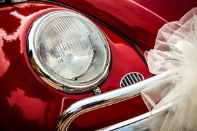 red vw beetle car with veil