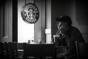 lonely visitor in a small coffee shop