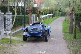locomobile, vintage steam-powered car on alley