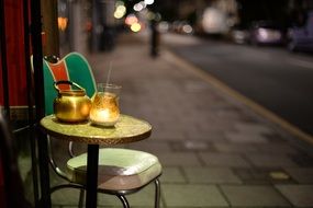 table with a kettle in the evening