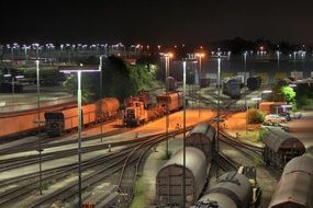 freight trains on marshalling yard at night