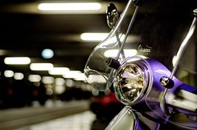 Vespa scooter in the parking lot