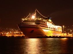 cruise ship in harbor at night