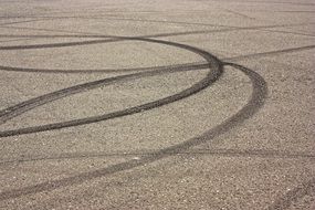 traces of car skidding on the road
