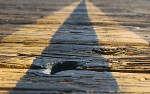 the rays of the sun on wooden boards