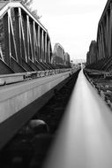 rails of a railway in black and white background