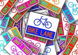 many colorful signs with a image of a bicycle