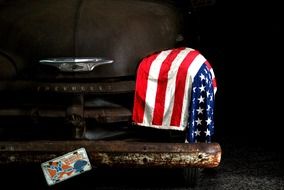 american flag on a old car