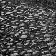 dirt road with large gravel close up