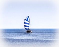 catamaran sailing on calm sea