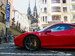 red ferrari on the road